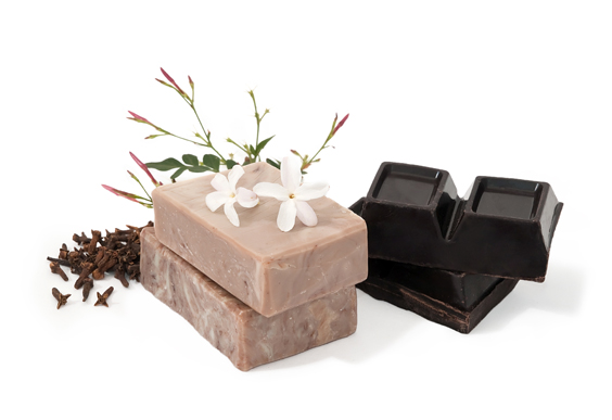 Stacked soap bars, jasmine flowers, chocolate bars and trimmings